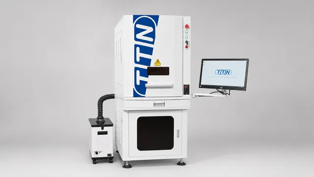Automark TTN Cliche Laser, a state-of-the-art plate making equipment for rapidly and accurately creating pad printing plates, shown with its integrated computer monitor displaying the TTN logo.