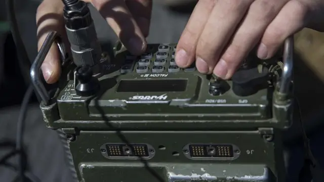 Military radio control panel with printed legends and identification markings